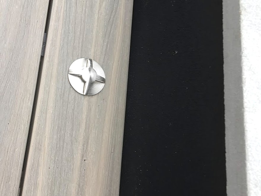 Close-up of a light set flush into timber decking