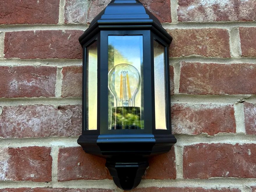 Traditional coach lantern fitted to a red brick wall